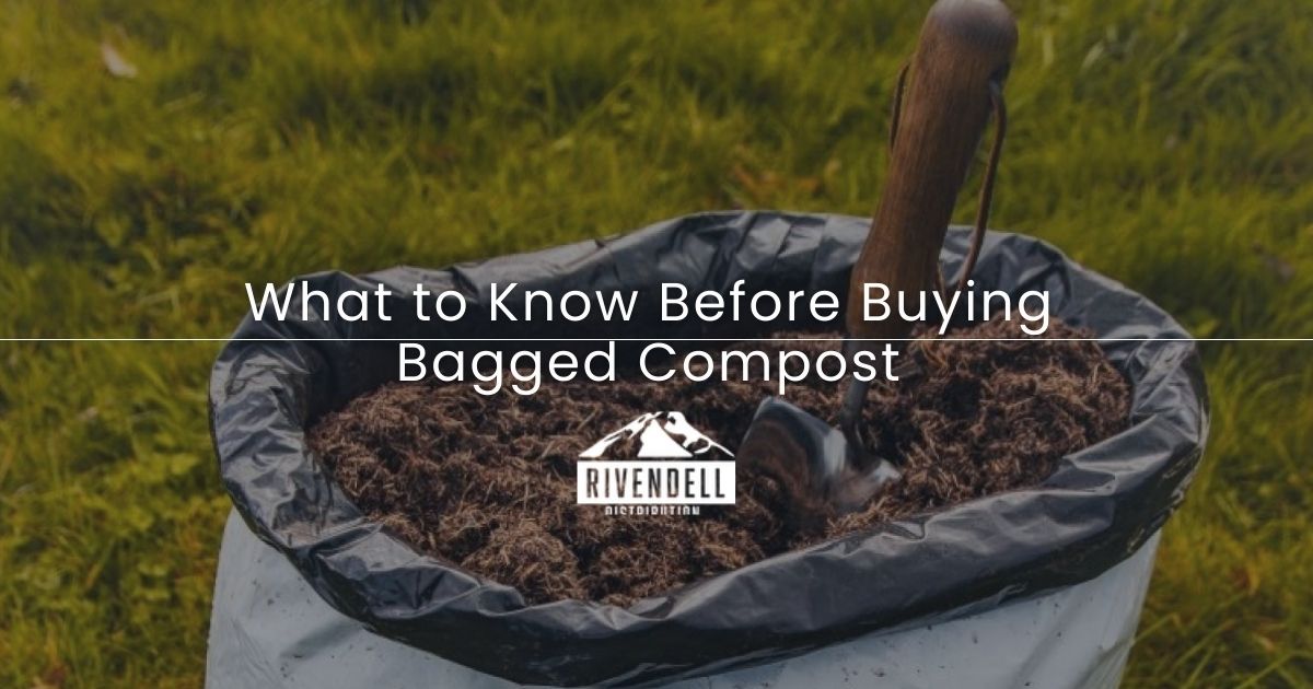 Bagged compost with a small garden trowel, outdoors on grass.