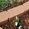 Edgestone Edger: Light brown concrete landscape edging for flowerbeds.
