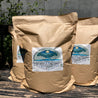 Organic worm castings in kraft paper bags outdoors

