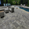 City Stone Supra Combo 60mm pavers: Gray, multi-sized stone patio around pool and seating area.

