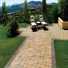 Tan and beige patio pavers create a relaxing outdoor space overlooking a scenic mountain view.
