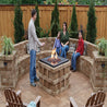Family enjoying fire pit in Rumblestone large rectangle patio design.
