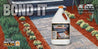 Landscaping product bottle shown next to a stone walkway lined with red mulch.
