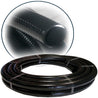 Black flexible PVC pipe coiled and banded, close-up view.
