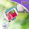 Gloved hand pouring garden insect spray concentrate into measuring cup; outdoor setting.
