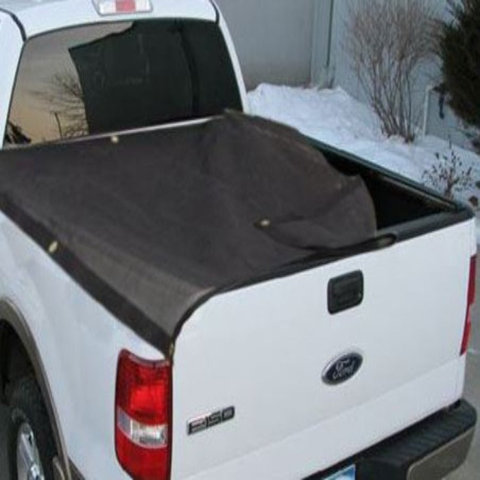 Black knitted truck tarp covering a white pickup truck bed.
