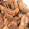 Large pieces of reddish-brown bark nuggets, ideal for landscaping.
