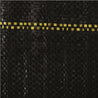 Black woven ground cover with yellow accents.
